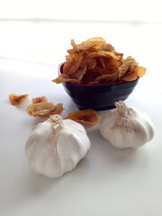 Banana Chips Slice with Garlic in White Background