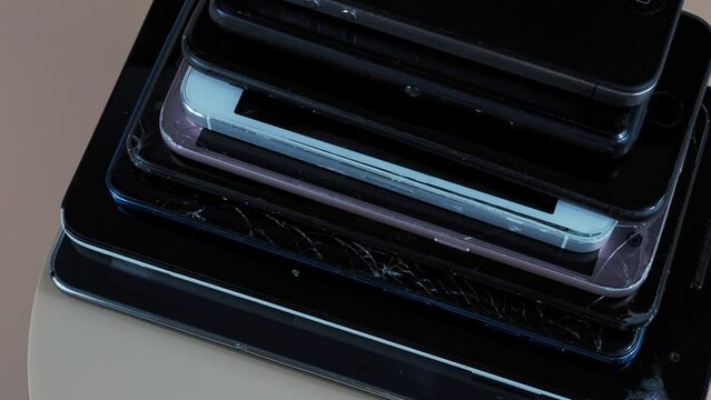 Outdated models of mobile phones and smartphones. Rotation of old smartphones.