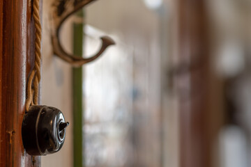 old wall switch and coat rack, horizontal photo