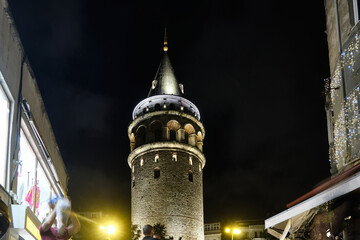 Obraz premium Illuminated Galata Tower in the nighttime. Low angle view. Istanbul, Turkey 