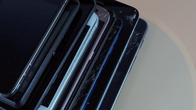 Outdated models of mobile phones and smartphones. Rotation of old smartphones.
