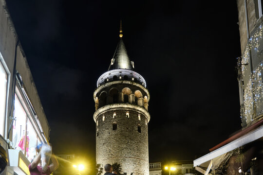 Illuminated Galata Tower in the nighttime. Low angle view. Istanbul, Turkey 