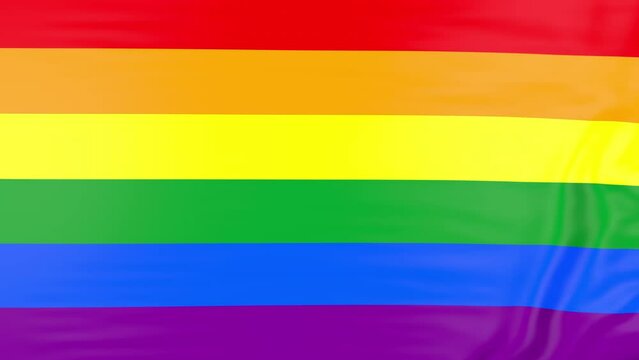 Rainbow flag  gay pride waving on wind.