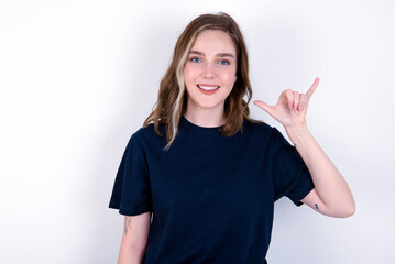 young caucasian woman wearing black T-shirt over white background showing up number six Liu with fingers gesture in sign Chinese language