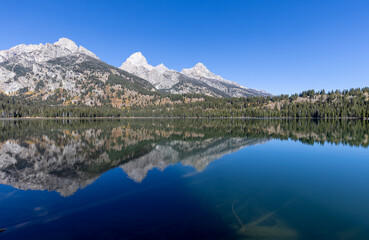 Scenic Reflection Landscape of the Tetons in Taggart Lake in Autumn