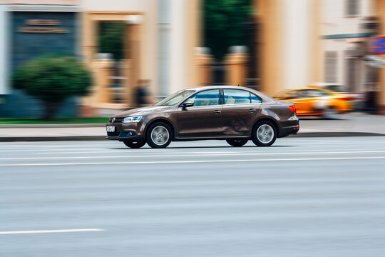 car Volkswagen Sagitar MK2 moving at high speed on a street. Car VW Jetta drives fast through the city with motion blur effect.