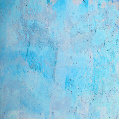 Beautiful Grunge light blue stucco Background. Abstract vintage backdrop. Decorative artistic Wall room Close up. Rough Surface plaster Texture With creative pattern
