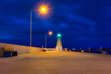 Lighthouse on the west breakwater in Nowy Port at dusk, Gdansk. Poland