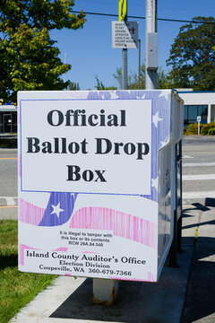 Oak Harbor, WA, USA - July 25, 2022; Official election ballot drop box for Island County in Oak Harbor Washington State with contact details