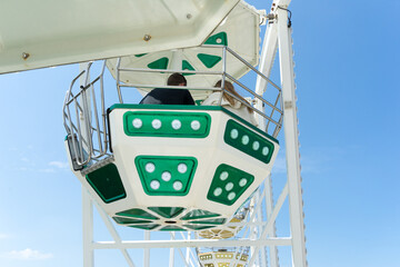 Ferris wheel in front of a clear blue sky on the beach of Kuehlungsborn on a beautiful summer day on the Baltic Sea in Mecklenburg-Western Pomerania.
