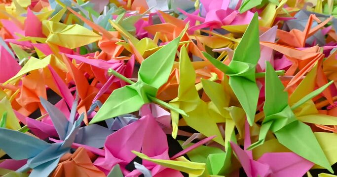 A group of colorful tsuru origamis. Japanese thousand tsurus legend