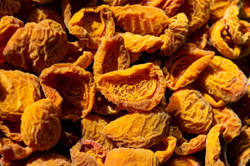 Fototapeta na wymiar Apricot harvesting. Drying apricots, dried apricots in an electric dryer at home. Organic fruits. Healthy food. Ripe apricots. a series of pictures.