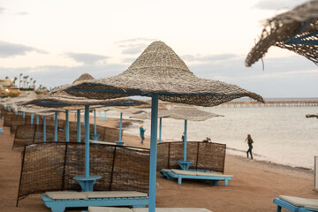 Straw beach rattan umbrellas at the beach