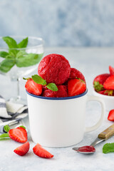 Strawberry sorbet with mint and fresh berries in a white cup. Fruit berry  summer ice cream. Vegetarian healthy dessert. Selective focus  - obrazy, fototapety, plakaty