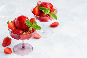 Strawberry sorbet with mint and fresh berries in glass bowls. Fruit berry  summer ice cream. Vegetarian healthy dessert. Selective focus  - obrazy, fototapety, plakaty
