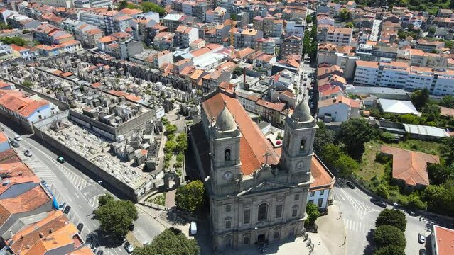 A camera drone flies backward over the Church of Our Lady of Lapa (Portuguese: Igreja de Nossa Senhora da Lapa), Porto, Portugal