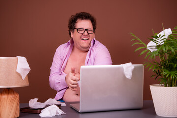 Funny fat man watching adult video.