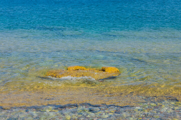 Beautiful view of coast line through transparent water. Nature backgrounds concept. 