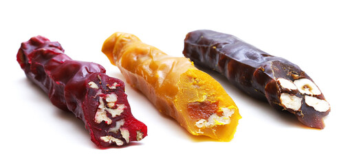Churchkhela is a traditional Georgian national delicacy of red, yellow and traditionally brown color on a white background