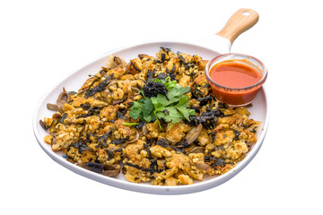 Vegan truffle orh luak chilli sauce served in a dish isolated on plain white background side view of Orh Luak Carrot Cake