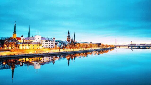 Cityscape Of Riga, Latvia. 4k Timelapse Cityscape During Midnight Lights. Christmas Season In Riga. Latvian Capital Skyline Cityscape. Night Life Of Riga. Dramatic Night Sky. Night City Illumination