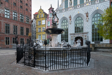 Bronze statue of Neptun, Fountain of Neptun in the Dlugi Targ street in the city of Gdansk, Poland. Famous historical monument in the city center. © Petr