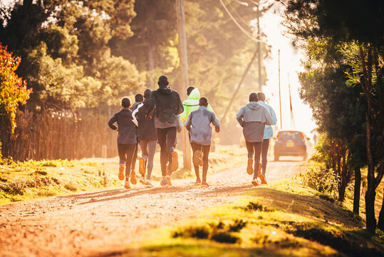 Group training in Kenya. A large group of Kenyan runners are preparing for the race. Endurance and marathon professional runners run on the red soil of Iten, home of champions. Africa, Kenya