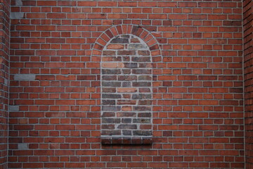 Bricked up window in old buildings.