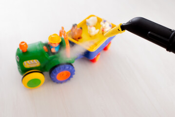 Fototapeta premium Steam cleaning toys. cleaning toys
