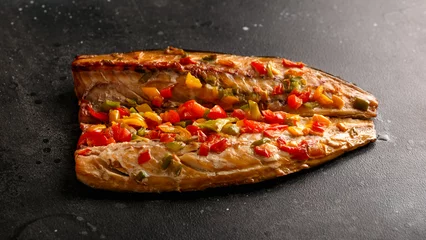 Foto op Plexiglas smoked mackerel with pieces of colorful pepper, top view. © lizaveta25