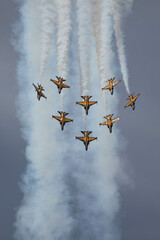 Eight Jets in vertical break with whit smoke