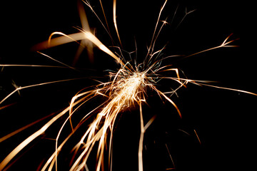 sparks in the dark. lines of light.