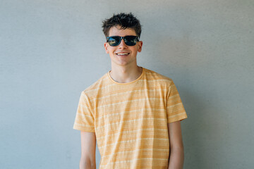 isolated teen boy with sunglasses