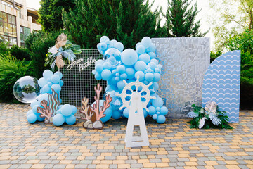 photo zone and decorations for the holiday in marine style in the fresh air.