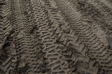 tire tracks on the beach sand