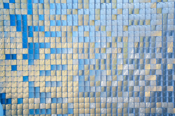 a wall with shiny sequins. glitter and shimmer.
