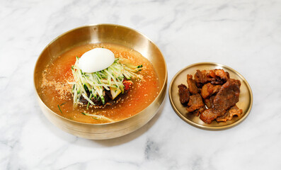 Korean Cool Noodles with Grilled pork rib on Bright Background.