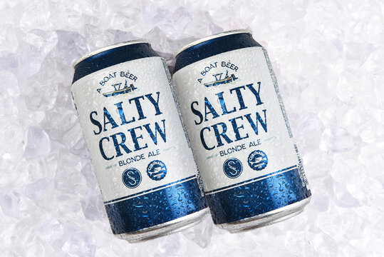 IRVINE, CALIFORNIA - 25 JUL 2022: Two cans of Salty Crew Blonde Ale in a bed of ice.