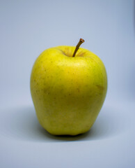 yellow apple on a white background