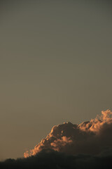 lone cloud top in the sunset