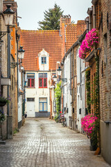 Fototapeta na wymiar Street corner in beautiful Bruges, flemish architecture, Belgium