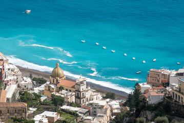 Naklejka premium Cityscape of Positano at the Amalfi coast and the church Santa Maria Assunta, Italy