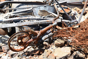 Rusty bicycle in the ruin of destroyed building after air strike. Consequences of Russia's military invasion of Ukraine.