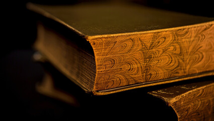 Close up of vintage thick book lying on flat surface isolated on black background. Stock footage....