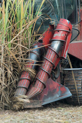 Detail of an agricultural machine in motion, harvesting sugar cane.