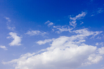 Naklejka na ściany i meble Beautiful blue sky and clouds background