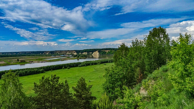 Landscapes of Siberia. Blue summer sky over a green valley along the Irtysh River in the Abalak area.
