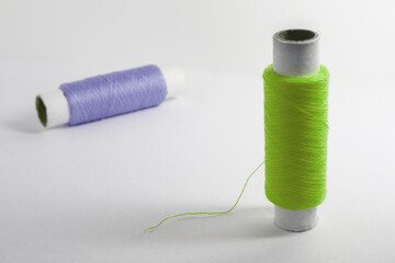 Two spools of thread
