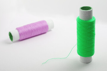 Two spools of thread