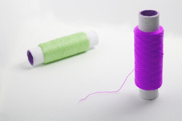 Two spools of thread